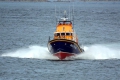 Pic by Tony Rive 29-04-09Local Lifeboat Coxwain Buz White at the Helm of the Margaret Joan and Fred Nye as it approaches St Peter Port. The Relief Lifeboat has just been re-engined and is doing a tour of all 35 Lifeboat Stations around Britain and Ireland showing off it'scapabilities.