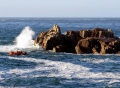 The inshore rescue boat next to the rocks - photo by Tony Rive