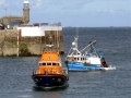 Pic by Tony Rive 17-09-15 One of two Marina Dories pull up alongside the 40ft local Fishing boat Defiance in St Peter Port after the St Peter Port Lifeboat Spirit of Guernsey towed it into Port, before towing it to it's berth alongside the Eastside of the Fish Quay.