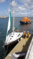 Lifeboat Daniel L Gibson stands by the French yacht Douze (12) in St Peter Port harbour 22-08-14 Pic by Tony Rive.jpg