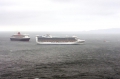 Lifeboat Spirit of Guernsey tows yacht Balmee towards the two Cruise ships Pic by Tony Rive