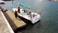 Seawater being pumped from the hull of the French yacht Douze (12) in St Peter Port 22-08-14 Pic by Tony Rive.jpg