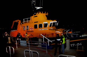 Pic by Tony Rive 12-03-16 Two of the 4 Man Crew walk off the St Peter Port Lifeboat Spirit of Guernsey after they had been rescued in their Motor Cruiser west of Tauteney Beacon after they had run out of Fuel somewhere between Herm and St Sampson's Harbour. The fast flowing northerly tide pushed their craft swiftly north before the Lifeboat men found them.