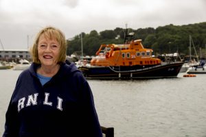 Pic by Tony Rive 14-06-16 Celia Allen MBE at St Peter Port Harbour opposite Lifeboat Spirit of Guernsey. She has been honoured in the Queen's Birthday Honours List for her work as Chairwomen for the Guernsey Lifeboat Guild and the Guernsey Samaritans.