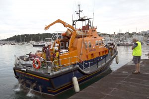 Pic by Tony Rive 21-07-16 Lifeboat Spirit of Guernsey about to mmor alongside number 1 Ro-Ro Ramp after bringing two Male Jetskier's back to St Peter Port with their Jetski on the Lifeboats Stern. The Lifeboat Crew picked up the two Males and their Jetski in Portinfer this evening after their Jetski's Battery had failed. The two men had all the right equipment but needed help as they couldn't make their own way ashore. Lifeboat Operation's Manager Peter Gill can be seen stood on the Ro-Ro Bamp waiting to take the Lifeboats Mooring Lines and meeting the two Men the Lifeboat Crew had just bought back to St Peter Port.