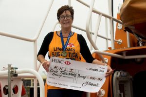 great-north-run-competitor-julie-eastwood-with-her-cheque-of-1000-for-the-guernsey-branch-of-the-rnli-28-10-16-pic-by-tony-rive